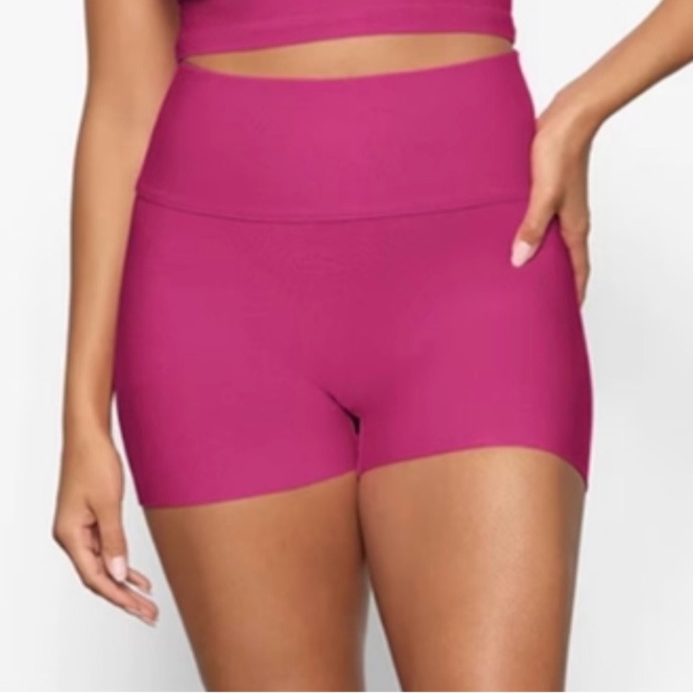 SKIMS SWIM KNIT MID WAIST SHORTS IN MAGENTA